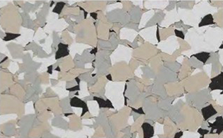 A close-up of a terrazzo floor surface with scattered beige, white, gray, and black stone chips.