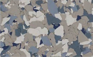 A close-up of multi-colored paint chips in shades of gray, blue, and white scattered randomly.