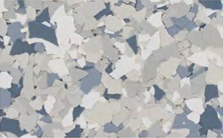 A close-up view of a floor with a speckled, multicolored gray, white, and blue epoxy chip pattern.